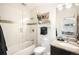Modern bathroom featuring a shower-over-tub with glass doors, granite countertop sink, and contemporary fixtures at 3220 Zuni St, Denver, CO 80211