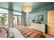 Spacious bedroom featuring a view of the balcony and a large dresser at 3220 Zuni St, Denver, CO 80211
