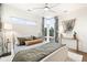 Bright bedroom featuring large windows, a modern ceiling fan, and stylish decor creating a cozy and inviting atmosphere at 3220 Zuni St, Denver, CO 80211