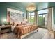 Inviting bedroom with large windows, decorative rug, and stylish lighting at 3220 Zuni St, Denver, CO 80211