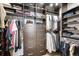 Organized walk-in closet with custom shelving and drawer systems at 3220 Zuni St, Denver, CO 80211
