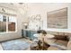 Chic dining area with custom cabinets, a wine cooler, and views of the outdoor space at 3220 Zuni St, Denver, CO 80211