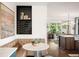 Cozy dining nook with banquette seating, stylish lighting, and an adjacent wine storage area at 3220 Zuni St, Denver, CO 80211