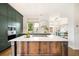 Gourmet kitchen with a large island, quartz countertops, custom cabinets, and stainless steel appliances at 3220 Zuni St, Denver, CO 80211