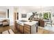 Open-concept kitchen featuring a large island, modern appliances, and a seamless connection to the dining area at 3220 Zuni St, Denver, CO 80211
