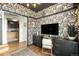 Chic office space featuring custom built-ins, decorative wallpaper, and seamless access to a bright, adjacent room at 3220 Zuni St, Denver, CO 80211