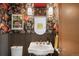 Chic powder room with floral wallpaper, gold accents, and a unique vessel sink at 3220 Zuni St, Denver, CO 80211