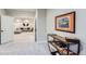 Basement hallway with console table and view of seating area at 9724 Cantabria Pt, Lone Tree, CO 80124