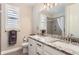 Bathroom with double vanity, granite countertop, and shower at 9724 Cantabria Pt, Lone Tree, CO 80124