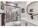 Modern bathroom featuring a sleek glass shower with gray tiled walls and modern fixtures at 9724 Cantabria Pt, Lone Tree, CO 80124