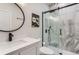 Updated bathroom with marble shower, black fixtures, and a sleek, modern design at 9724 Cantabria Pt, Lone Tree, CO 80124