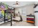 Bedroom with bunk bed, graffiti wall, and dresser at 9724 Cantabria Pt, Lone Tree, CO 80124