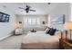 Main bedroom with a king-size bed and built-in drawers under the bed at 9724 Cantabria Pt, Lone Tree, CO 80124