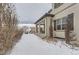 House exterior with snow covered backyard at 9724 Cantabria Pt, Lone Tree, CO 80124