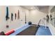 Basement home gym with treadmill and floor mats at 9724 Cantabria Pt, Lone Tree, CO 80124