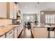 Bright and airy kitchen with granite countertops, modern appliances, and a view of the dining area at 9724 Cantabria Pt, Lone Tree, CO 80124