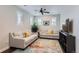 Living room with two sofas, a rug, and a TV at 9724 Cantabria Pt, Lone Tree, CO 80124