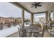 Covered outdoor patio with views of the neighborhood, perfect for relaxing and entertaining at 9724 Cantabria Pt, Lone Tree, CO 80124