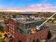 Aerial view of a modern condo with city views and a rooftop deck at 1143 Auraria Pkwy # 402, Denver, CO 80204