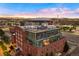 Penthouse unit with modern glass rooftop; city and mountain views at 1143 Auraria Pkwy # 402, Denver, CO 80204