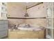 Relaxing bathroom featuring a corner soaking tub and glass block shower at 1143 Auraria Pkwy # 402, Denver, CO 80204