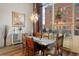 Rustic dining table with chairs and city views at 1143 Auraria Pkwy # 402, Denver, CO 80204