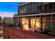 Building exterior showcasing large windows and city views at dusk at 1143 Auraria Pkwy # 402, Denver, CO 80204