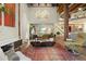 Open living area with exposed beams and hardwood floors at 1143 Auraria Pkwy # 402, Denver, CO 80204