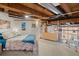 Spacious loft bedroom with exposed beams and large windows at 1143 Auraria Pkwy # 402, Denver, CO 80204