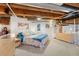 Spacious loft bedroom with exposed beams and large windows at 1143 Auraria Pkwy # 402, Denver, CO 80204