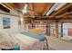 Spacious loft bedroom with exposed beams and large windows at 1143 Auraria Pkwy # 402, Denver, CO 80204