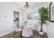 Bright dining area featuring a glass table, modern chairs, and a decorative plant at 3137 S Glencoe St, Denver, CO 80222