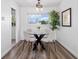Cozy dining area with a glass table, seating for four, and a decorative tree at 3137 S Glencoe St, Denver, CO 80222
