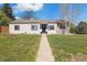 Charming single-story home with a well-maintained lawn, inviting entrance, and classic curb appeal at 3137 S Glencoe St, Denver, CO 80222