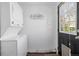 Convenient laundry area features a stackable washer and dryer near back entry at 3137 S Glencoe St, Denver, CO 80222