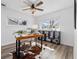 Bright office space with a wooden desk, ceiling fan, and a hide rug at 3137 S Glencoe St, Denver, CO 80222