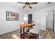 Home office with wood desk, cowhide rug, and modern ceiling fan at 3137 S Glencoe St, Denver, CO 80222
