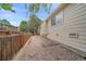 Side view of fenced backyard, presenting privacy and ample space for outdoor activities at 12229 W Berry Ave, Littleton, CO 80127