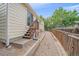 A backyard with a wooden fence and a step-down deck, providing an outdoor retreat at 12229 W Berry Ave, Littleton, CO 80127