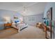 Large bedroom with a vaulted ceiling, ceiling fan, carpeted floor, and natural light at 12229 W Berry Ave, Littleton, CO 80127