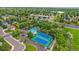 Overhead image showing community pool and tennis courts with nearby lake in the distance at 12229 W Berry Ave, Littleton, CO 80127