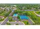 Great aerial view of the community pool, tennis courts, and ample parking at 12229 W Berry Ave, Littleton, CO 80127