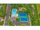 Aerial view highlighting the community pool, tennis courts, playground, and parking at 12229 W Berry Ave, Littleton, CO 80127