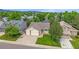 Inviting single-story home featuring an attached two-car garage and well-manicured front lawn at 12229 W Berry Ave, Littleton, CO 80127