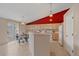 Bright eat-in kitchen with tile floor, modern appliances and adjacent breakfast nook at 12229 W Berry Ave, Littleton, CO 80127
