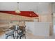 Bright eat-in kitchen with tile floor, modern appliances and adjacent breakfast nook at 12229 W Berry Ave, Littleton, CO 80127