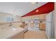 Bright kitchen with tile floor and plenty of counter space and modern appliances at 12229 W Berry Ave, Littleton, CO 80127
