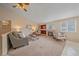 Inviting living room with a cozy fireplace, comfortable seating, and a relaxed atmosphere at 12229 W Berry Ave, Littleton, CO 80127