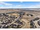 An aerial view of a beautiful community with walking trails and mountain views in the background at 15753 E Indian Brook Cir, Parker, CO 80134