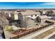 Aerial view of the property, showcasing a spacious backyard, patio, and privacy fence at 15753 E Indian Brook Cir, Parker, CO 80134